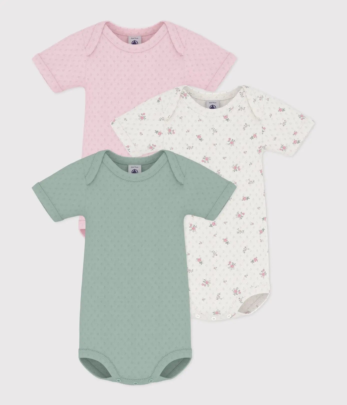 Petit Bateau | Setje van katoenen body's van opengewerkt katoen met korte mouwen en bloemenprint
